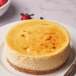 Air fryer cheesecake on a plate and ready to eat.