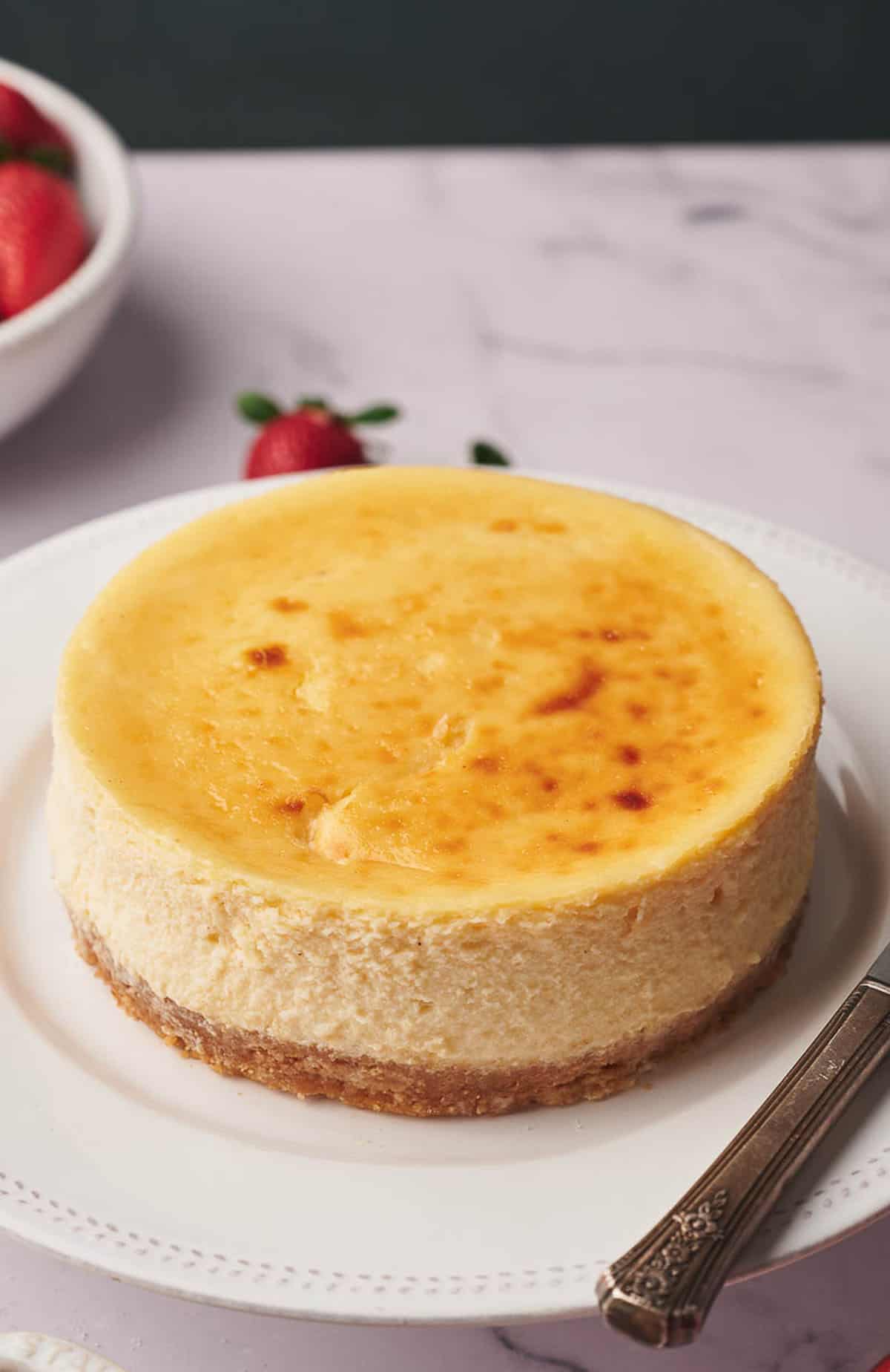 Air fryer cheesecake on a plate and ready to eat.