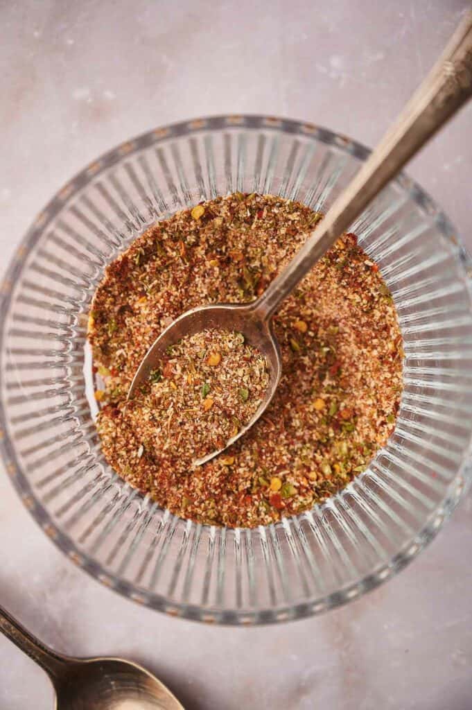 A glass bowl of taco seasoning, freshly made.