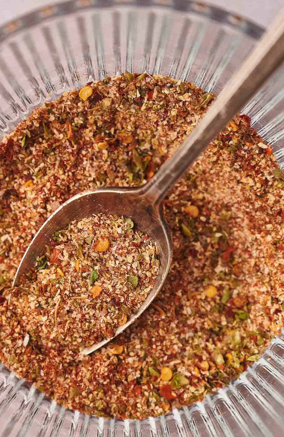 Homemade taco seasoning in a glass dish.