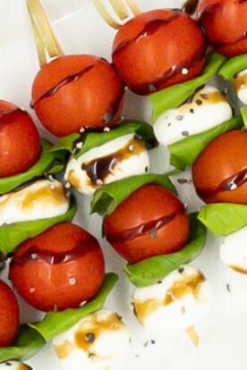 Caprese skewers on a serving plate.