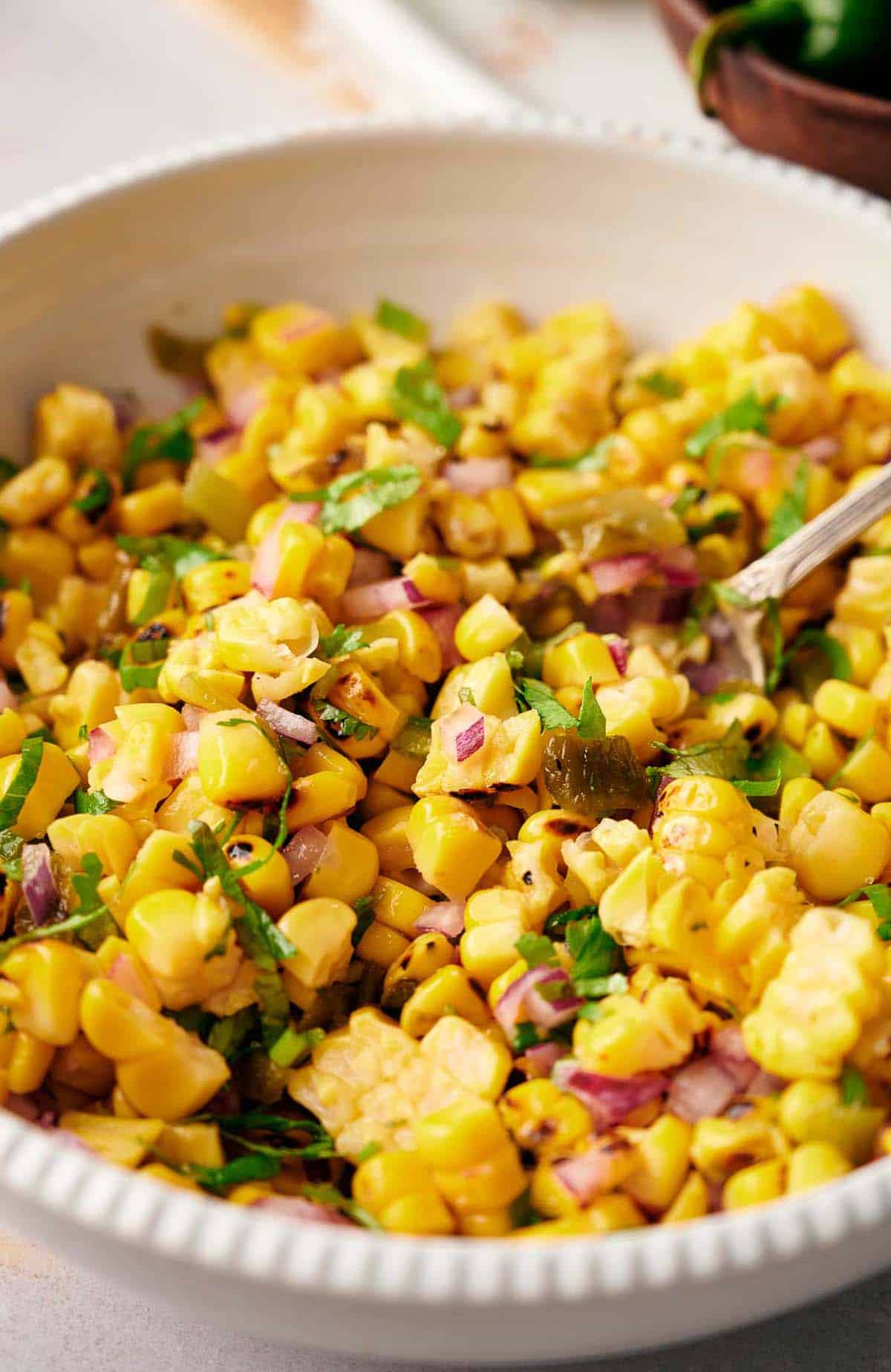 Delicious bowl of Chipotle corn salsa in a serving bowl.