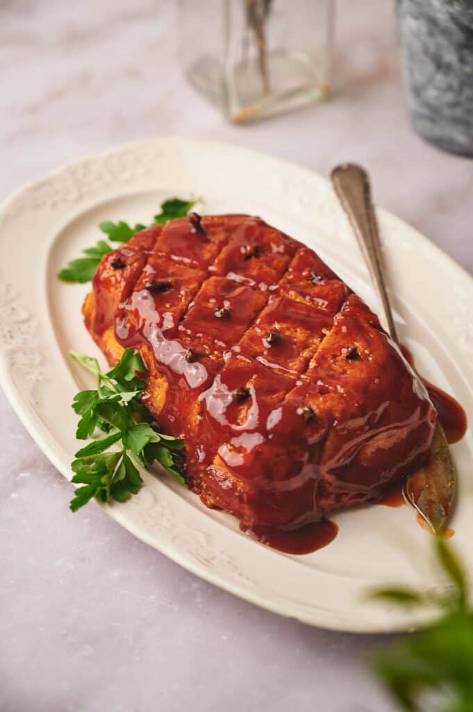 vegan ham on a serving dish, ready to eat.