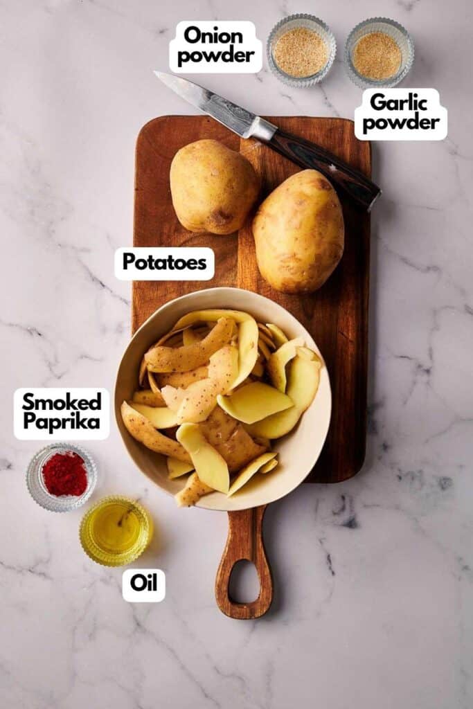 Ingredients needed; russet potatoes, onion powder, garlic powder, smoked paprika, and olive oil.