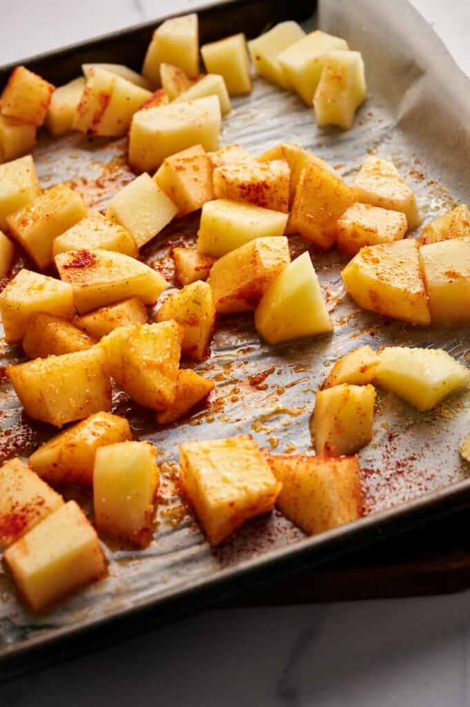 Potatoes tossed in seasoning and olive oil.