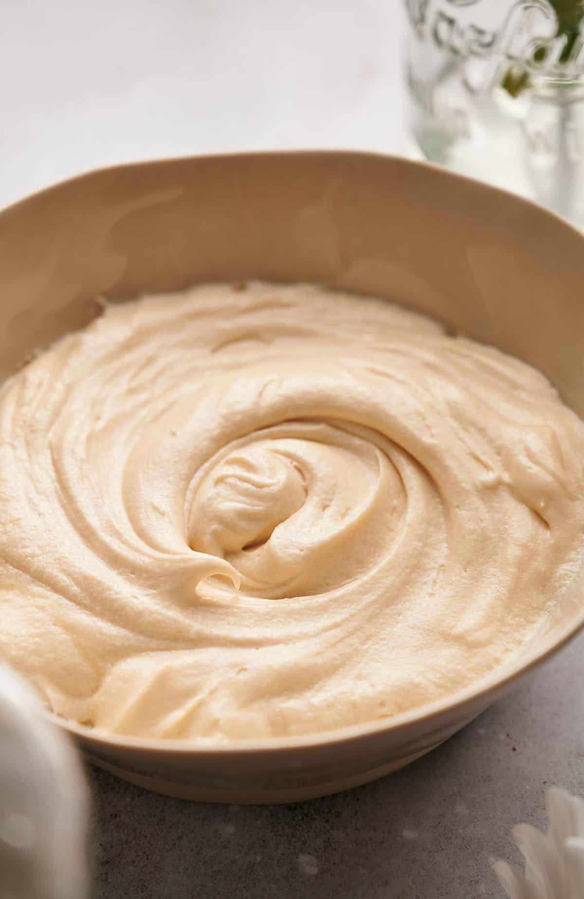 A bowl of freshly made delicious homemade cream cheese frosting.