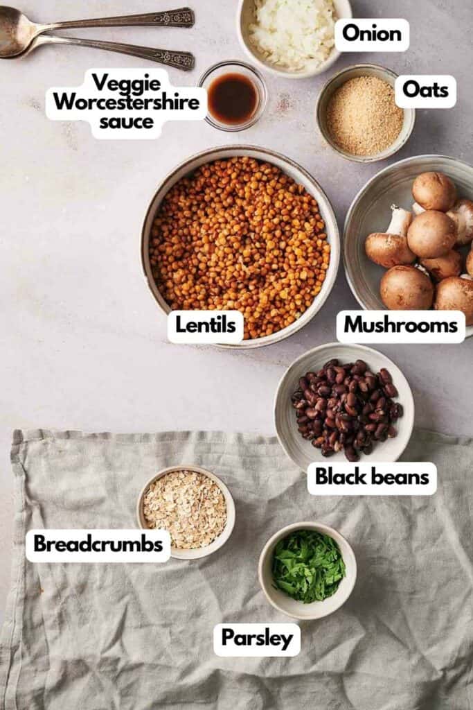 Ingredients needed; veggie Worcestershire sauce, lentils, onion, oats, mushrooms, black beans, fresh parsley, and Panko breadcrumbs.