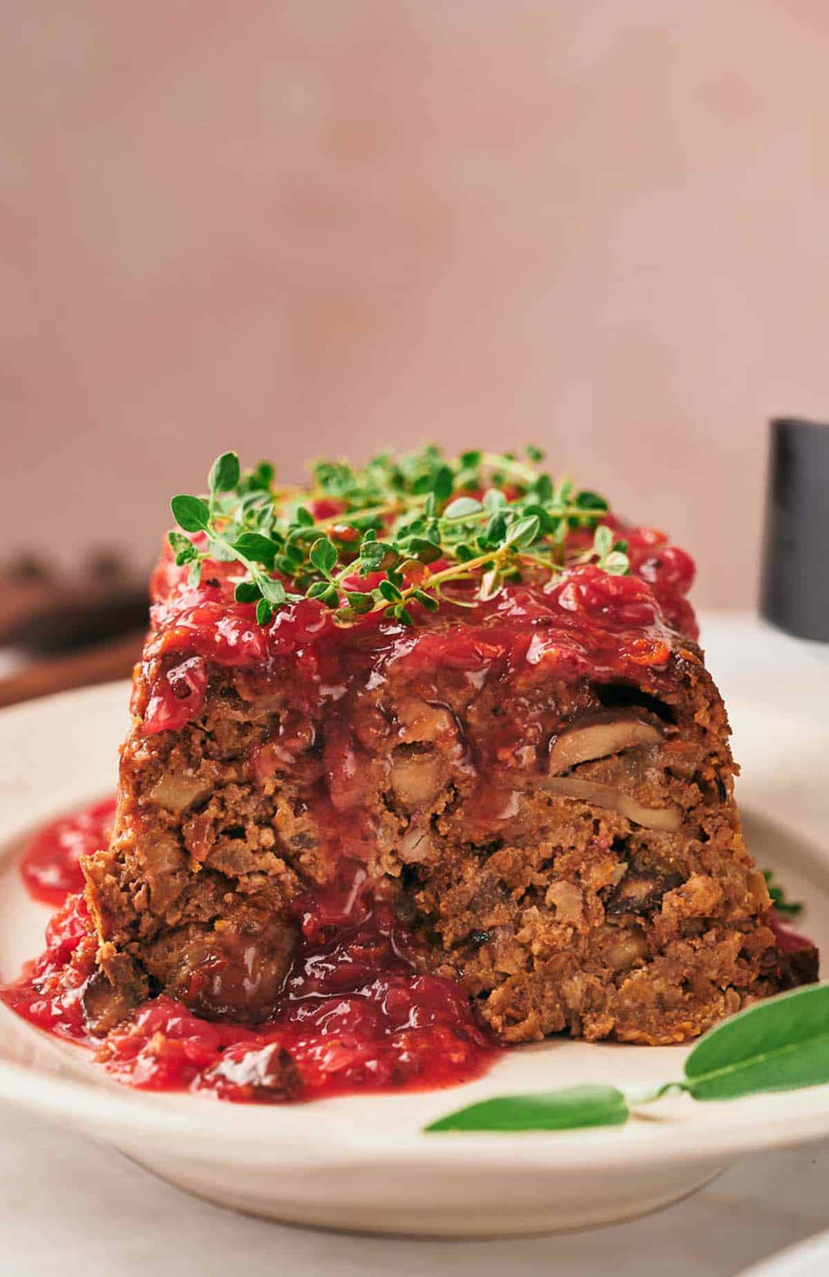 A plate with a piece of nut roast on it.