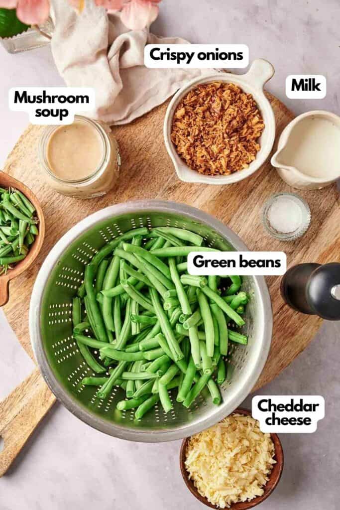 Ingredients for green bean casserole on a cutting board.