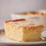 A slice of sopapilla cheesecake on a plate.