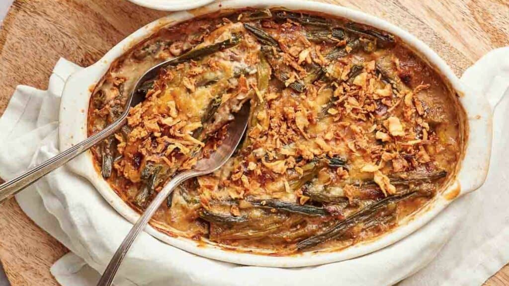 A green bean casserole with a spoon in it.
