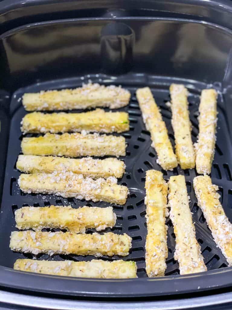 Fried zucchini sticks in an air fryer.