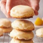 A stack of lemon cookies on a cooling rack.