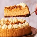 A slice of pumpkin cheesecake on a plate.
