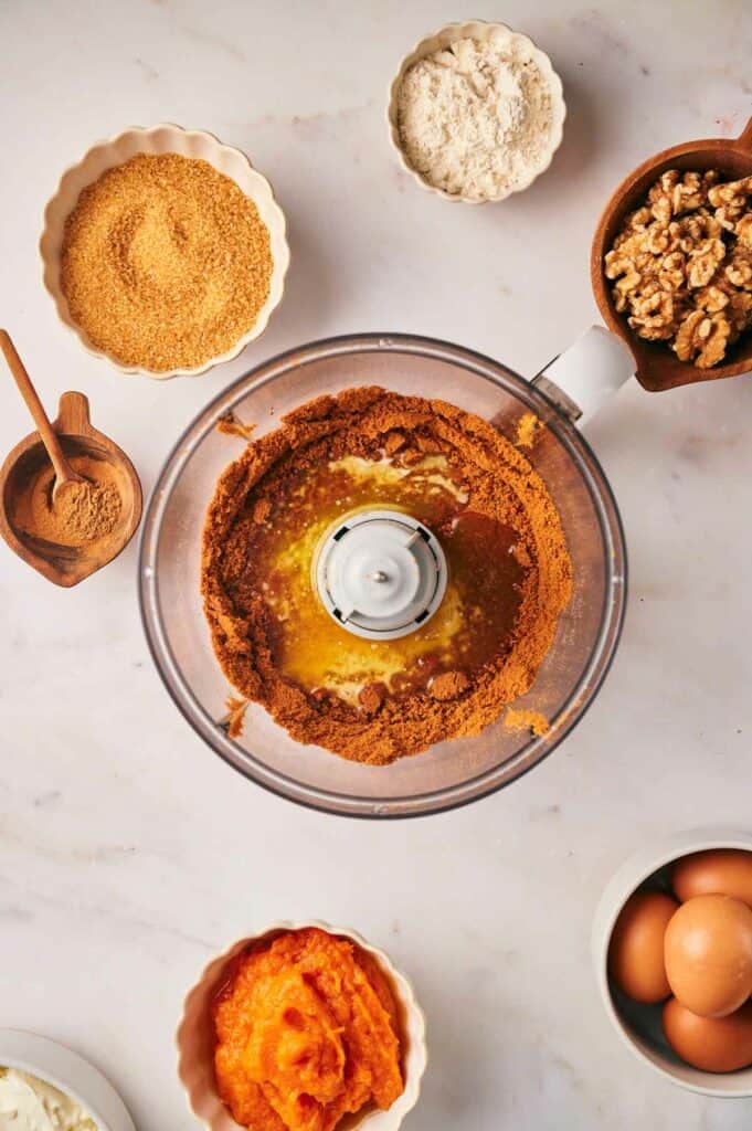 A food processor filled with various ingredients.