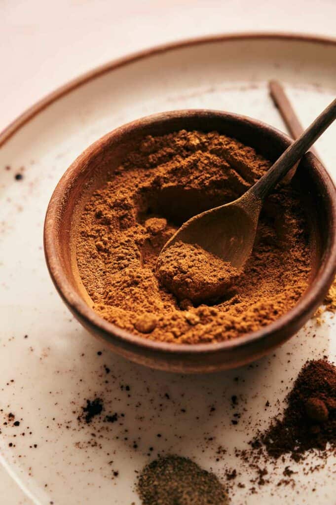 Pumpkin Pie Spice in a bowl on a plate.