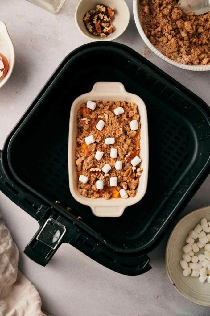 Sweet potato casserole in a baking dish in an air fryer.
