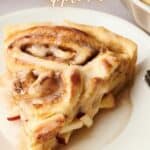 Cinnamon roll apple pie on a plate.