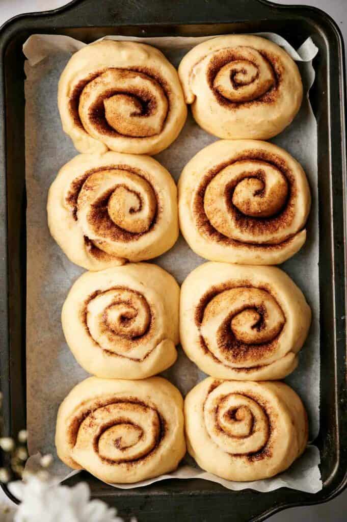 Cinnamon rolls on a baking sheet.