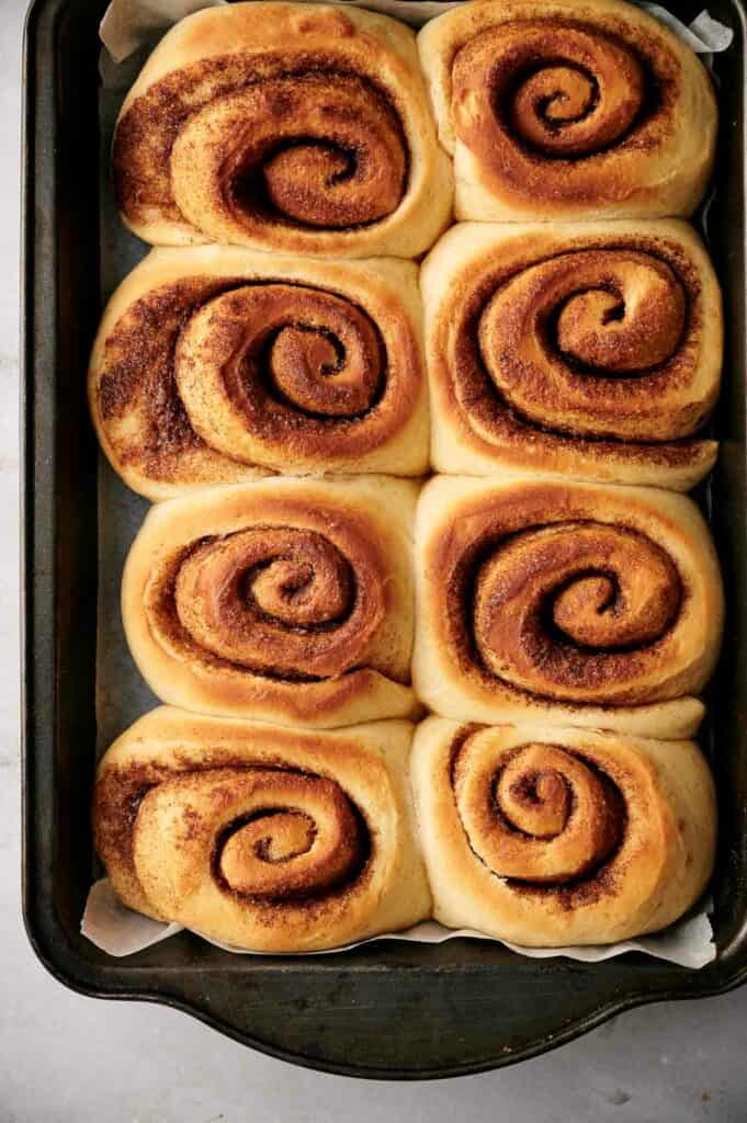 Cinnamon rolls in a baking pan.