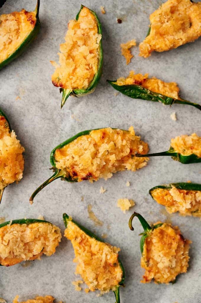 Jalapeno poppers on a baking sheet.