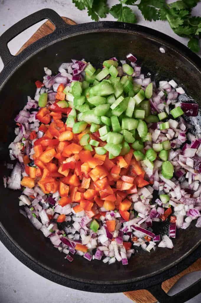 Chopped vegetables in a frying pan.