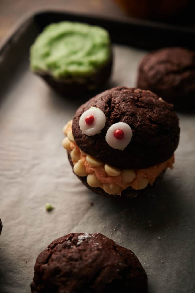 Chocolate monster cookies on a baking sheet.