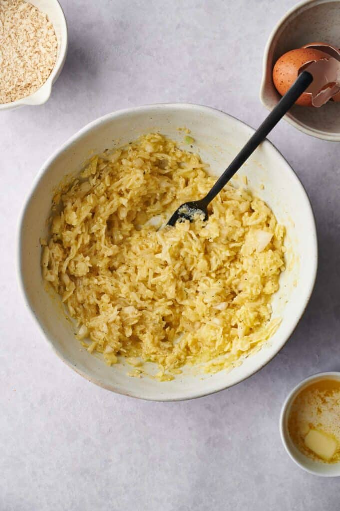 A bowl with eggs, flour and other ingredients.