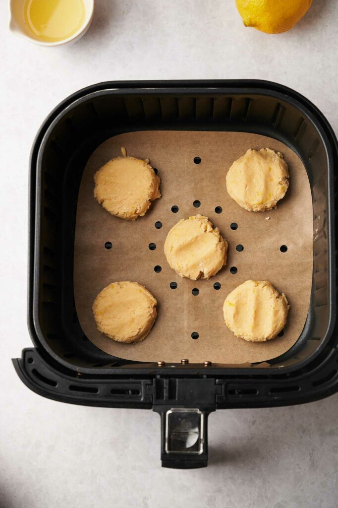 An air fryer filled with lemon cookie batter.