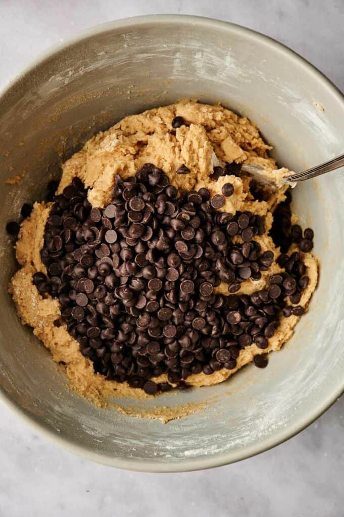 Chocolate chip cookie dough in a bowl.