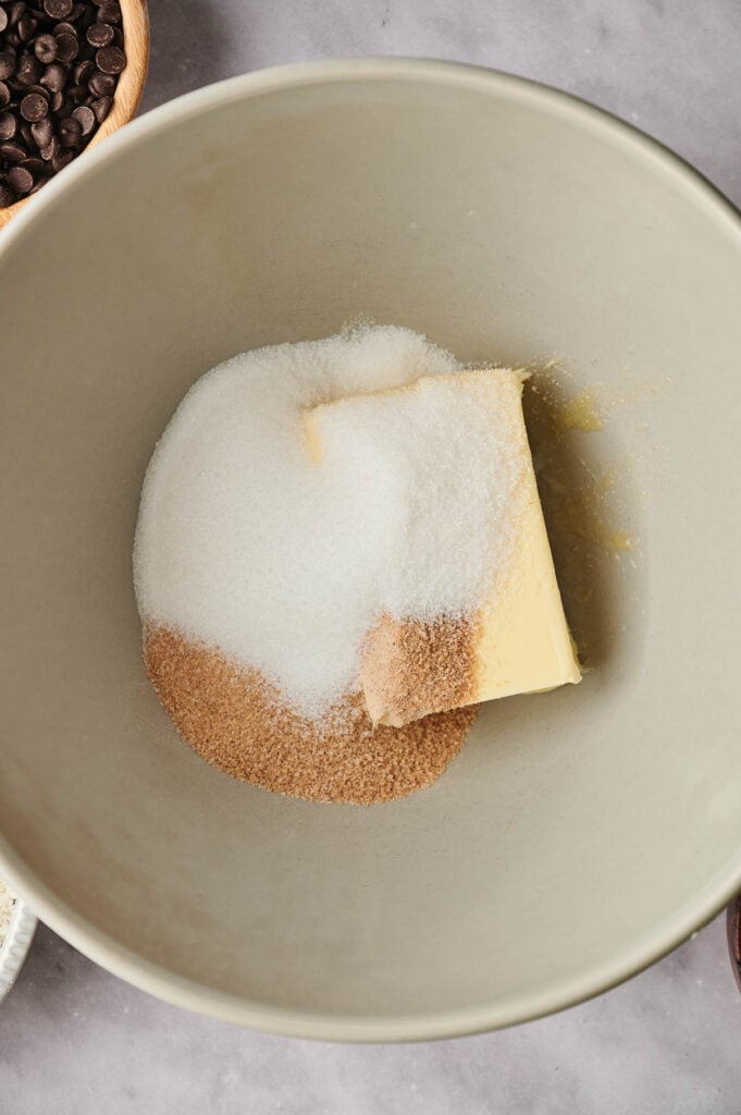 Butter and sugar in a bowl on a table.