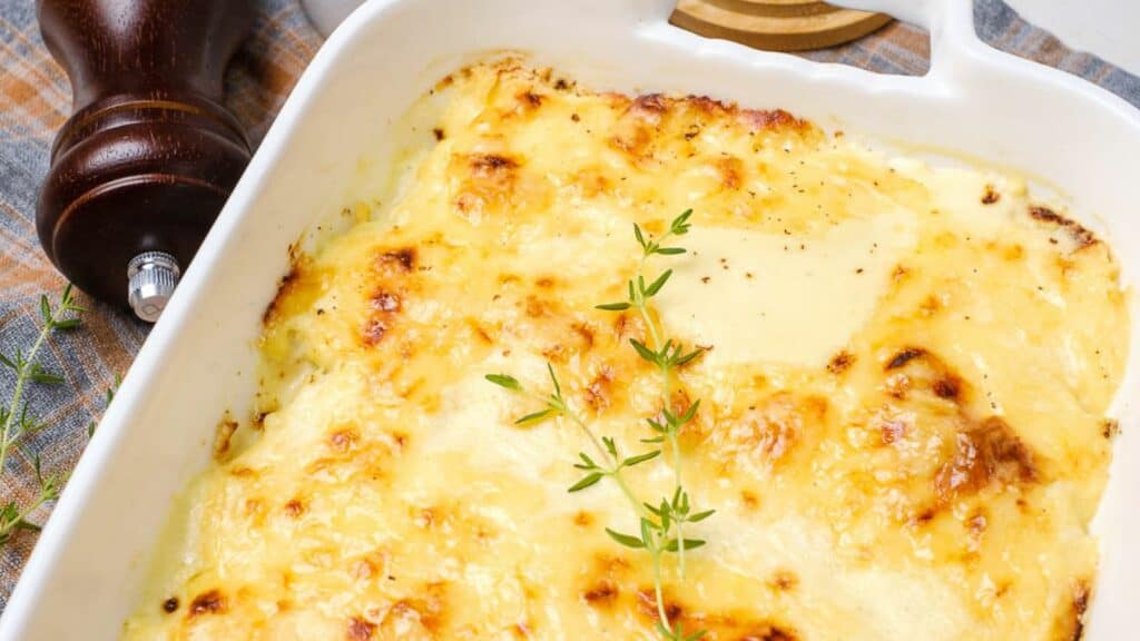 A casserole dish with Dauphinoise Potatoes in it.
