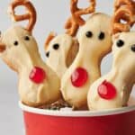 Reindeer cookies in a cup.
