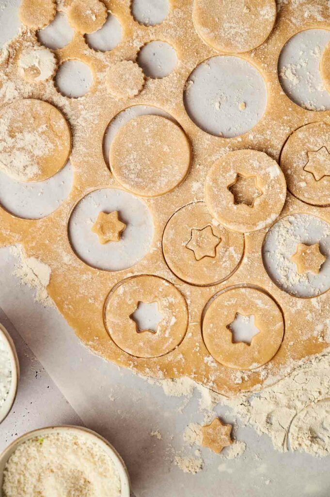 A baking sheet with cookies and icing on it.