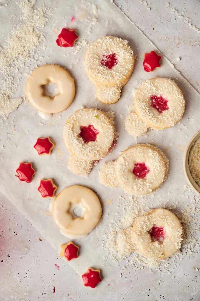 A baking sheet with cookies and icing on it.