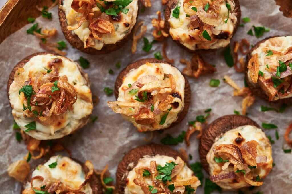 Stuffed mushrooms topped with onions and parmesan cheese.