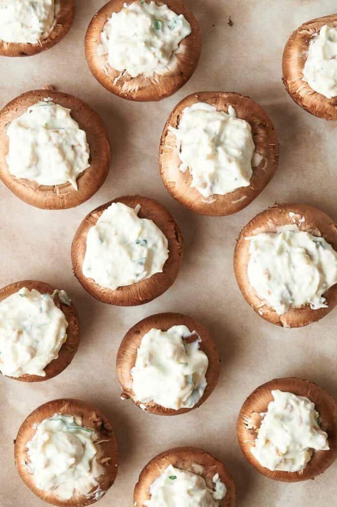 Stuffed mushrooms with cream cheese and parsley.