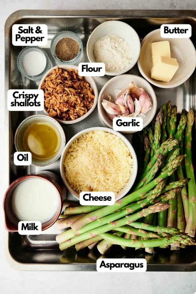 A tray with ingredients for an asparagus casserole dish.
