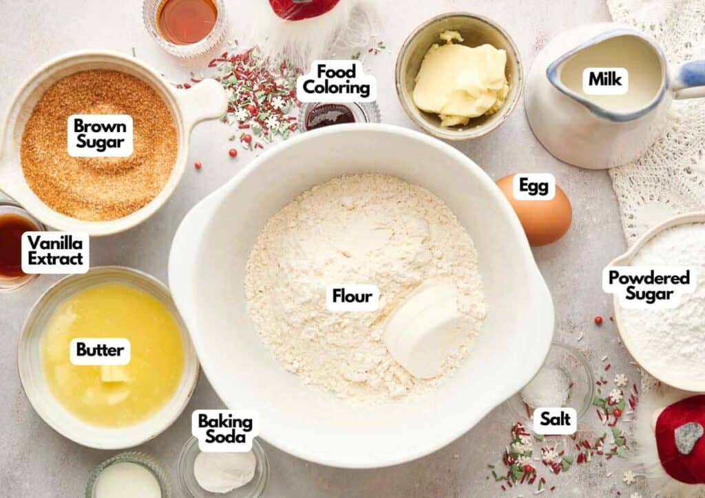 Baking ingredients organized on a table, including flour, egg, milk, powdered sugar, brown sugar, butter, baking soda, salt, vanilla extract, food coloring—perfect for making air fryer chocolate crinkle cookies.