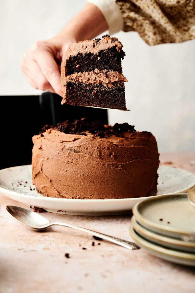 A person indulging in a delicious air fryer chocolate cake.