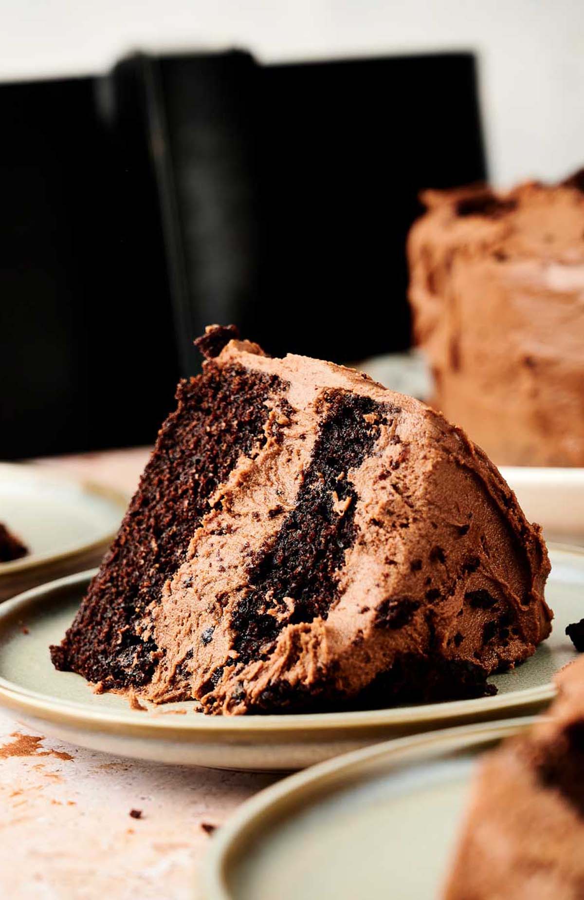 A slice of chocolate cake on a plate, made using an air fryer.