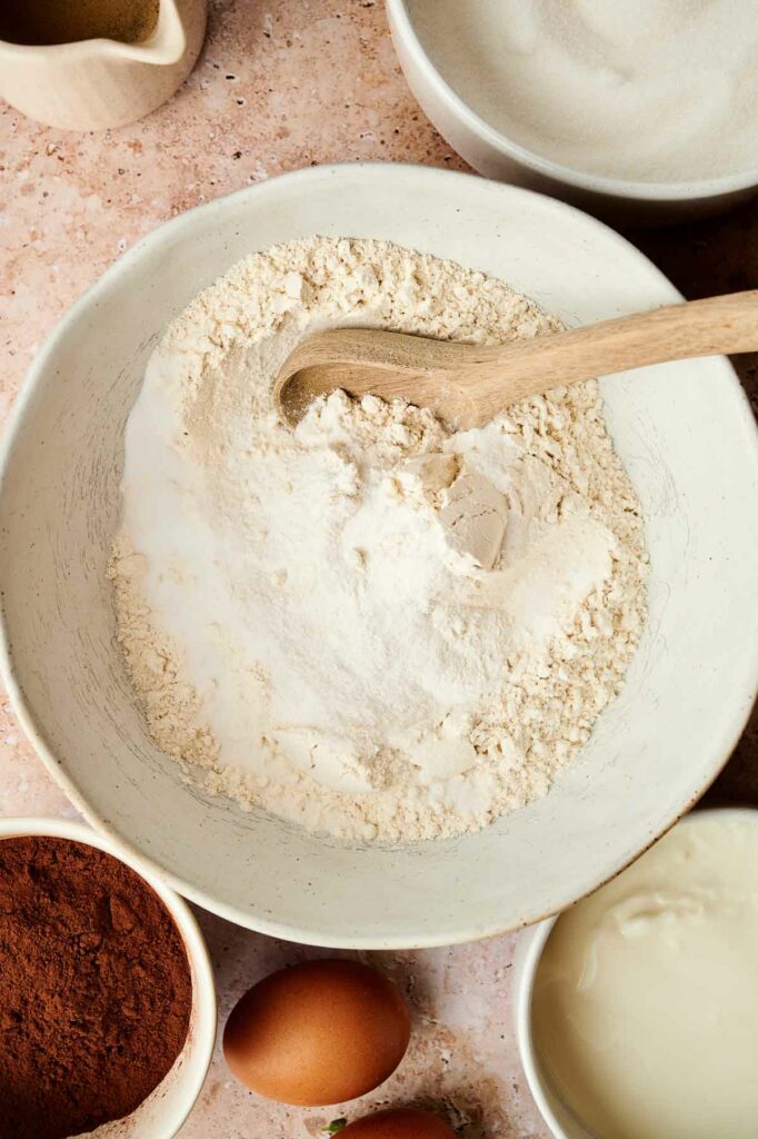 A bowl of flour on a table.