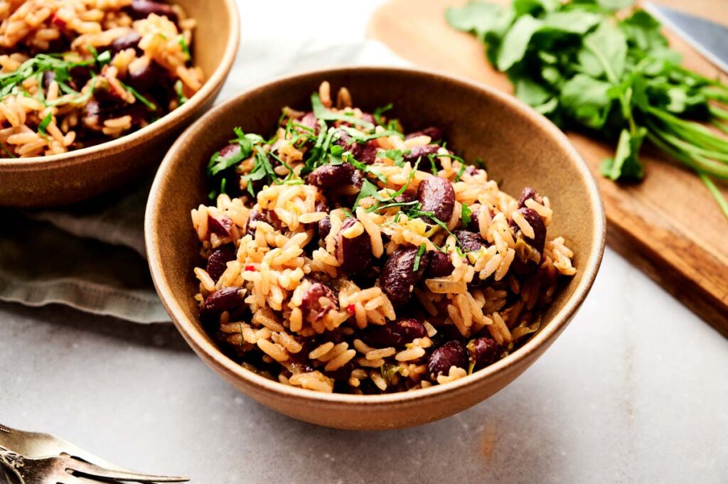 Two bowls of Jamaican red beans and rice.