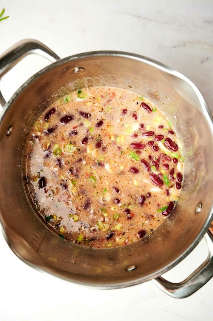 A pot of Jamaican red beans and rice, filled with delicious beans and vegetables.