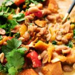 A delicious and flavorful Thai peanut curry dish that combines the natural sweetness of sweet potatoes with the bold flavors of peanuts and fresh cilantro.
