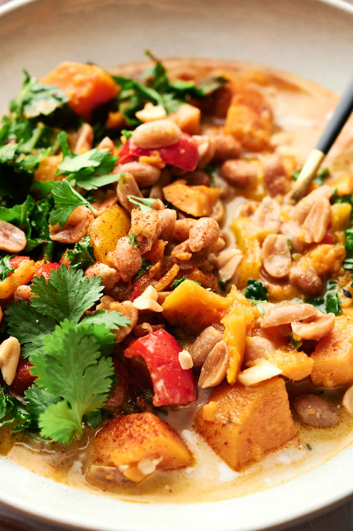 A delicious and flavorful Thai peanut curry dish that combines the natural sweetness of sweet potatoes with the bold flavors of peanuts and fresh cilantro.