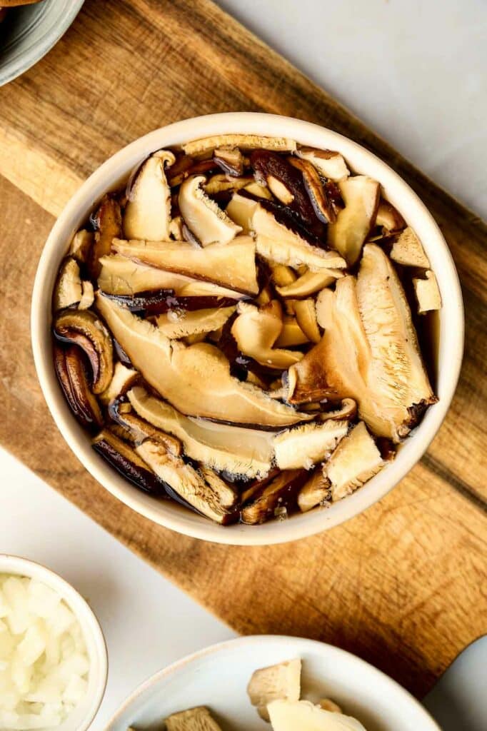 A bowl of mushrooms for a wild rice casserole dish.