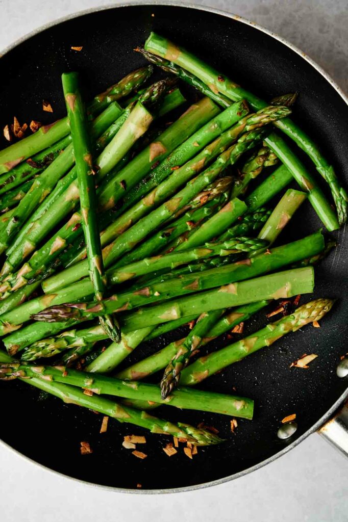 A pan of air fryer asparagus.