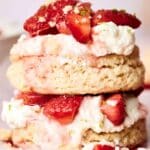 Close-up of a delectable Strawberry Shortcake, showcasing layers of fluffy biscuit, rich vanilla cream, and juicy fresh strawberries.