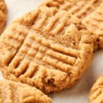 A close-up shot captures the intricate crisscross fork pattern on a classic peanut butter cookie, epitomizing the charm of homemade Peanut Butter Cookies.